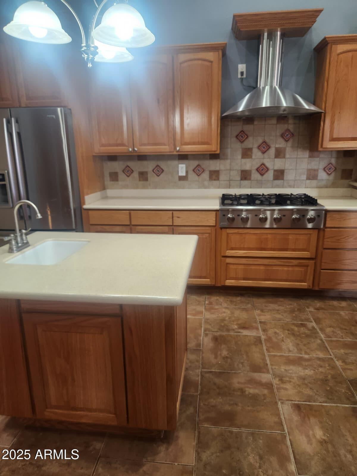 1766 East Golf Course Road Douglas, AZ 85607 - Photo 10 of 29 a kitchen with kitchen island granite countertop a sink cabinets and stainless steel appliances
