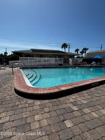 a view of swimming pool having outdoor seating