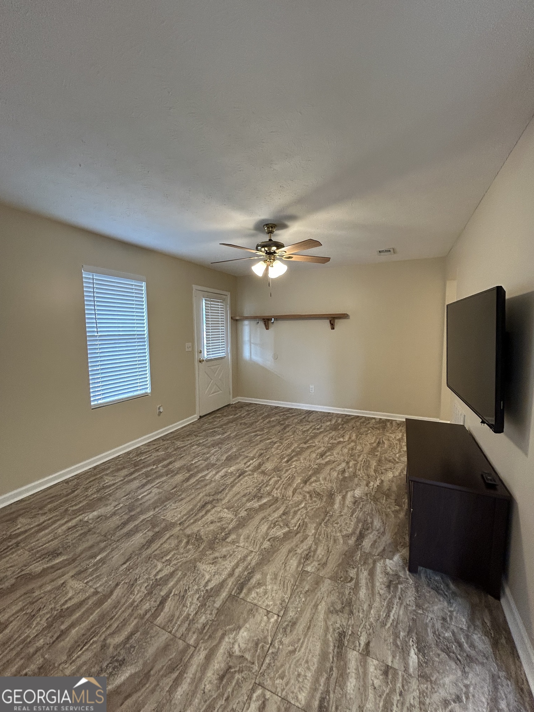 206 Ann Murphy Road West Point, GA 31833 - Photo 12 of 57 a bedroom with a bed and a flat screen tv