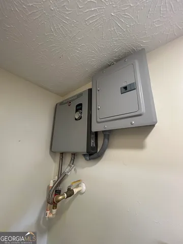 a bedroom with a bed and a chandelier fan