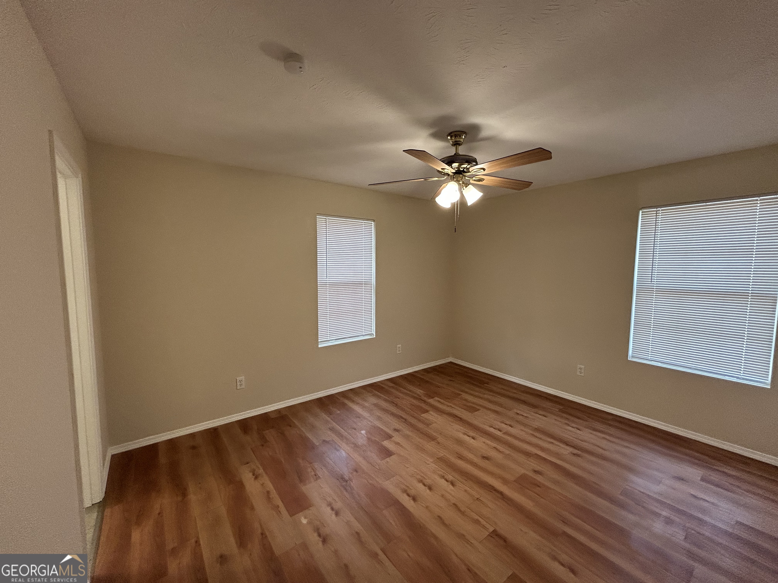 206 Ann Murphy Road West Point, GA 31833 - Photo 24 of 57 a view of an empty room with wooden floor and a window