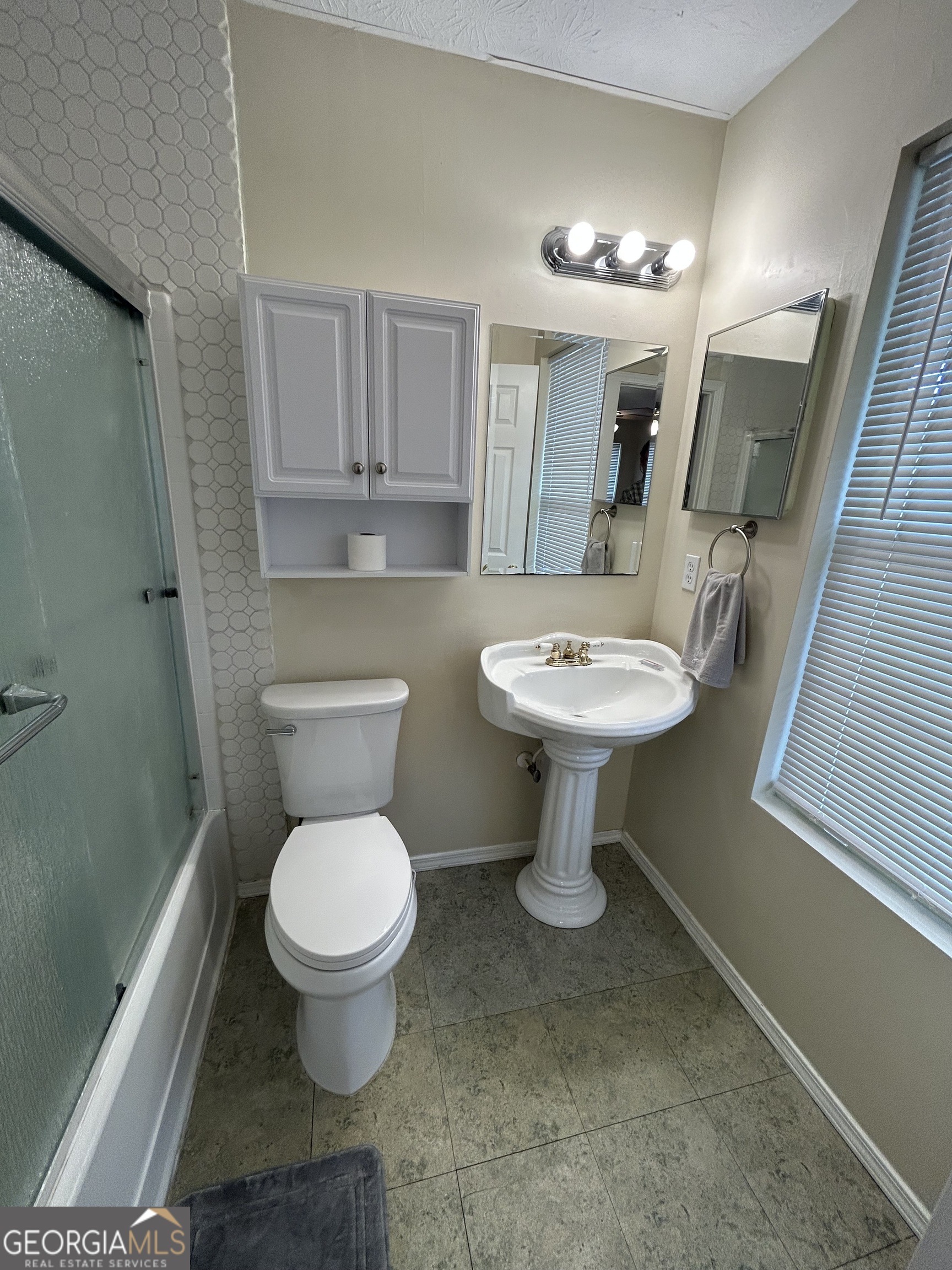 206 Ann Murphy Road West Point, GA 31833 - Photo 31 of 57 a bathroom with a toilet sink and mirror