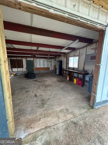 a room with furniture and a large window