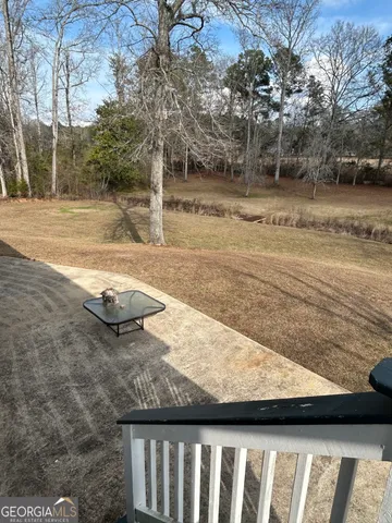 a view of a street next to a yard