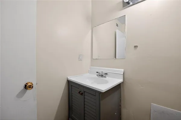 a bathroom with a sink and mirror