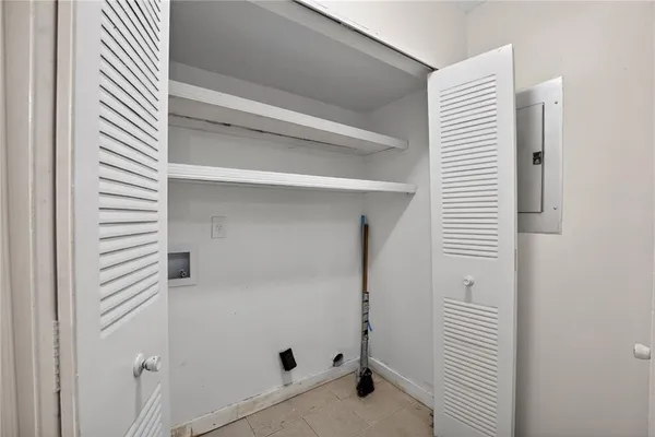 a bathroom with a shower and a sink