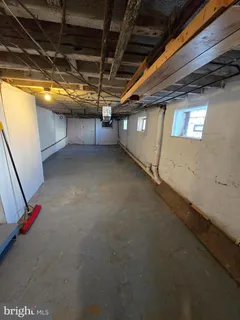 a view of empty room with wooden walls