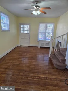 a view of livingroom with hardwood floor and ceiling fan