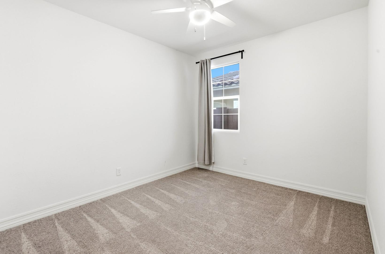 20437 East Estrella Road Queen Creek, AZ 85142 - Photo 25 of 33 an empty room with a window