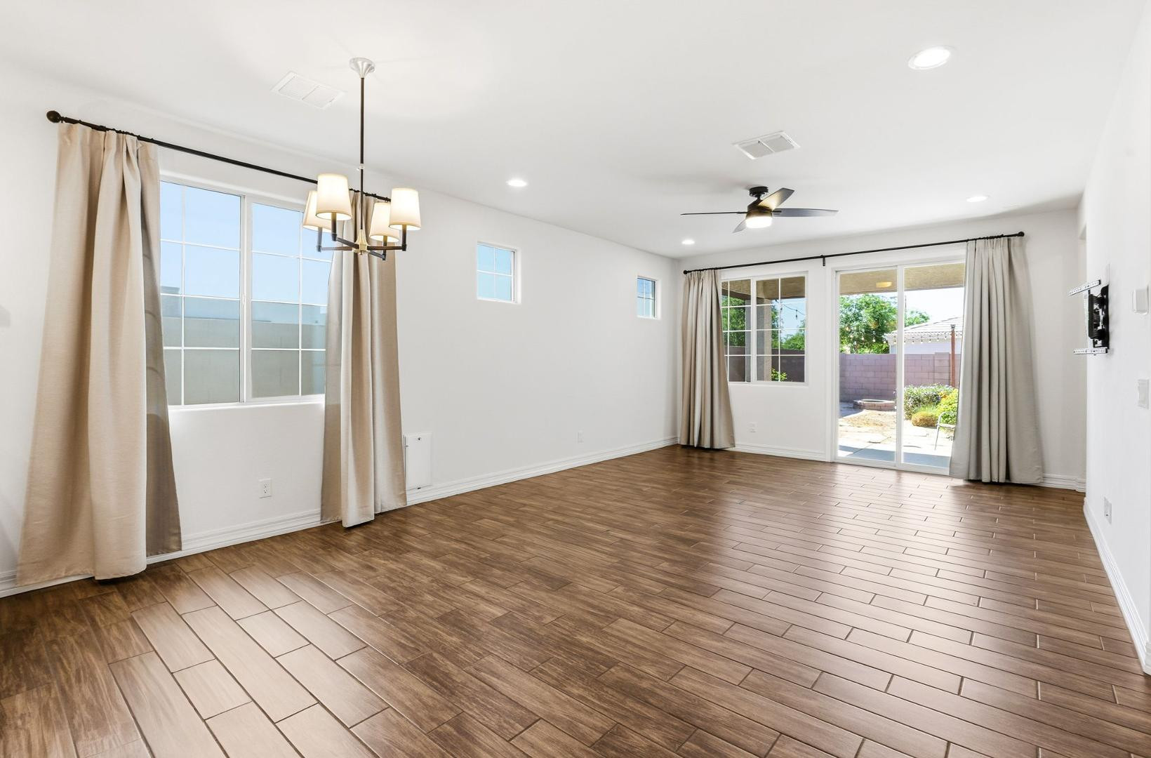 20437 East Estrella Road Queen Creek, AZ 85142 - Photo 7 of 33 a view of empty room with wooden floor and fan