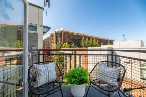 a view of balcony with furniture