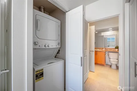 a bathroom with a toilet and a view of bathroom