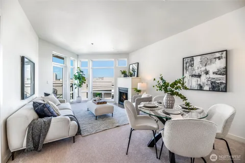 a living room with furniture potted plant and a window