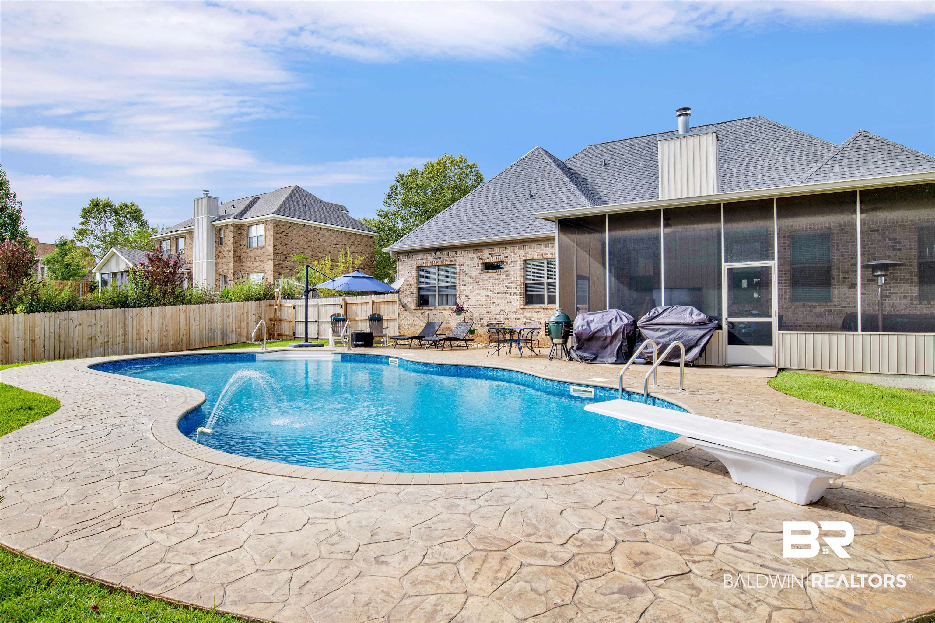 12418 Cambron Trail Daphne, AL 36527 - Photo 44 of 44 View of swimming pool featuring pool water feature, a diving board, a sunroom, and a patio area