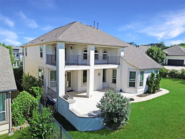 a front view of a house with a yard and porch