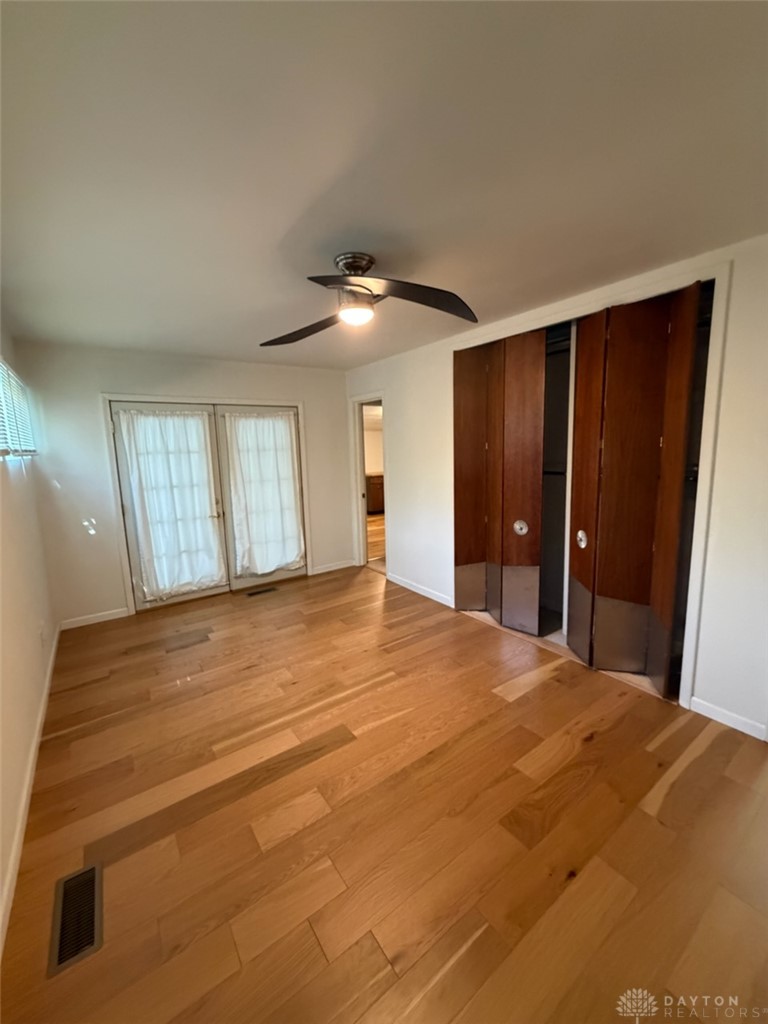 4924 Bayside Drive Riverside, OH 45431 - Photo 11 of 21 This spacious bedroom features lustrous hardwood flooring and ample natural light.