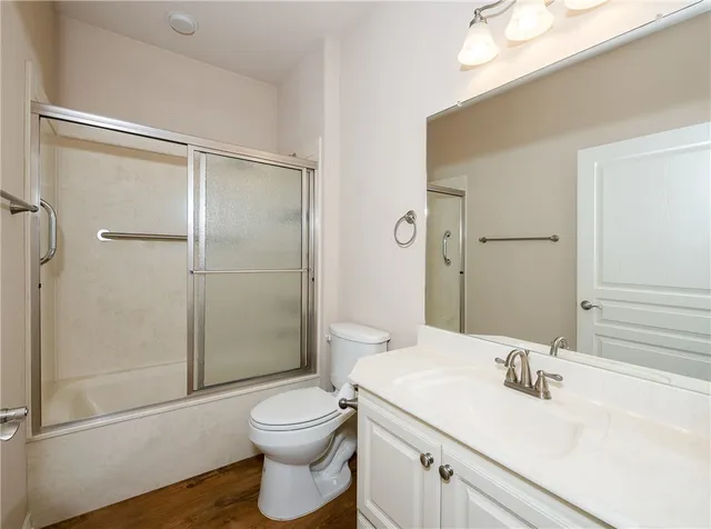 a view of a house with a yard and garage