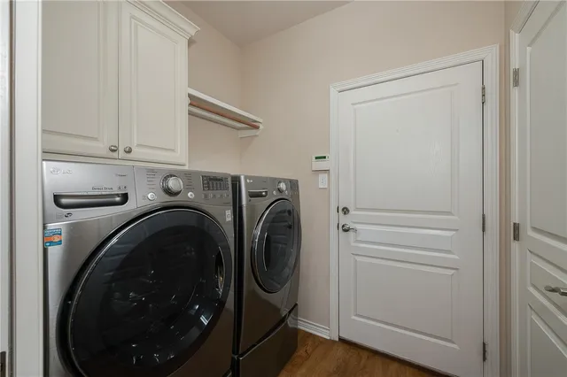 a kitchen with stainless steel appliances granite countertop a stove refrigerator and microwave