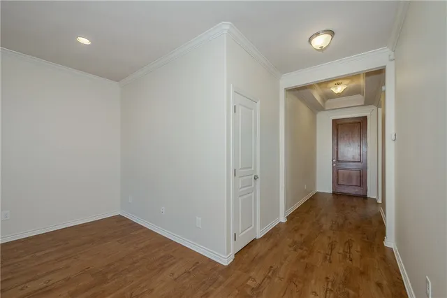 a view of hallway with wooden floor