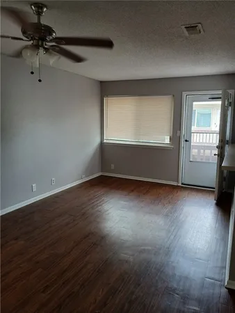 a kitchen with granite countertop cabinets stainless steel appliances and a sink