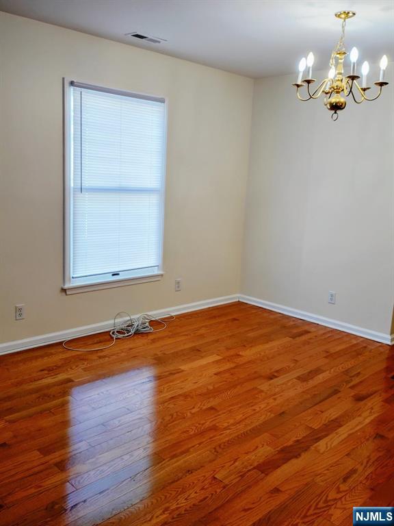 70 Willow Street, Unit 2 Bloomfield, NJ 07003 - Photo 3 of 8 a view of a room with wooden floor and cabinet