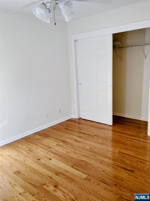 70 Willow Street, Unit 2 Bloomfield, NJ 07003 - Photo 8 of 8 a view of empty room with wooden floor and fan