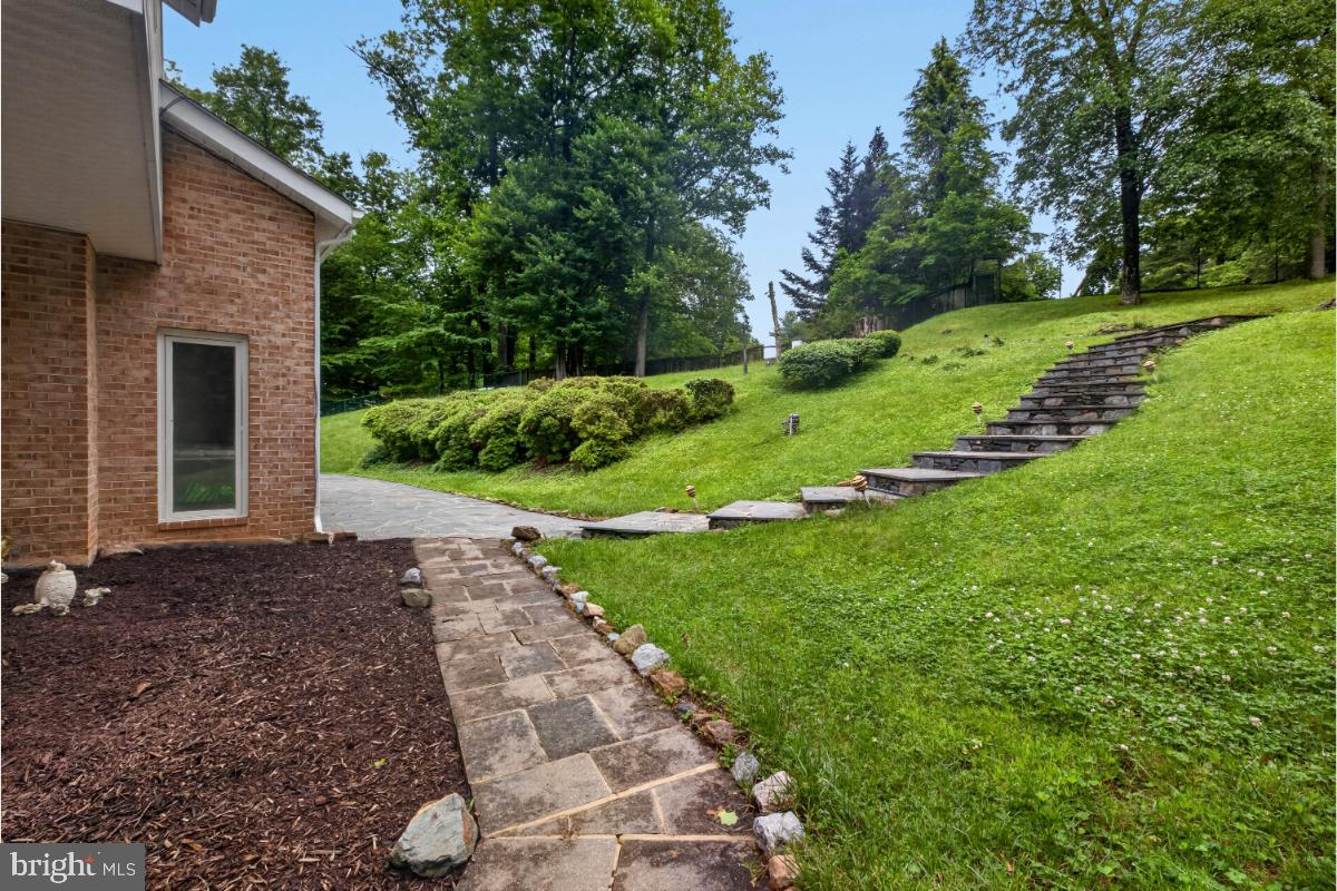10320 Glen Road Potomac, MD 20854 - Photo 57 of 75 a view of a house with a yard