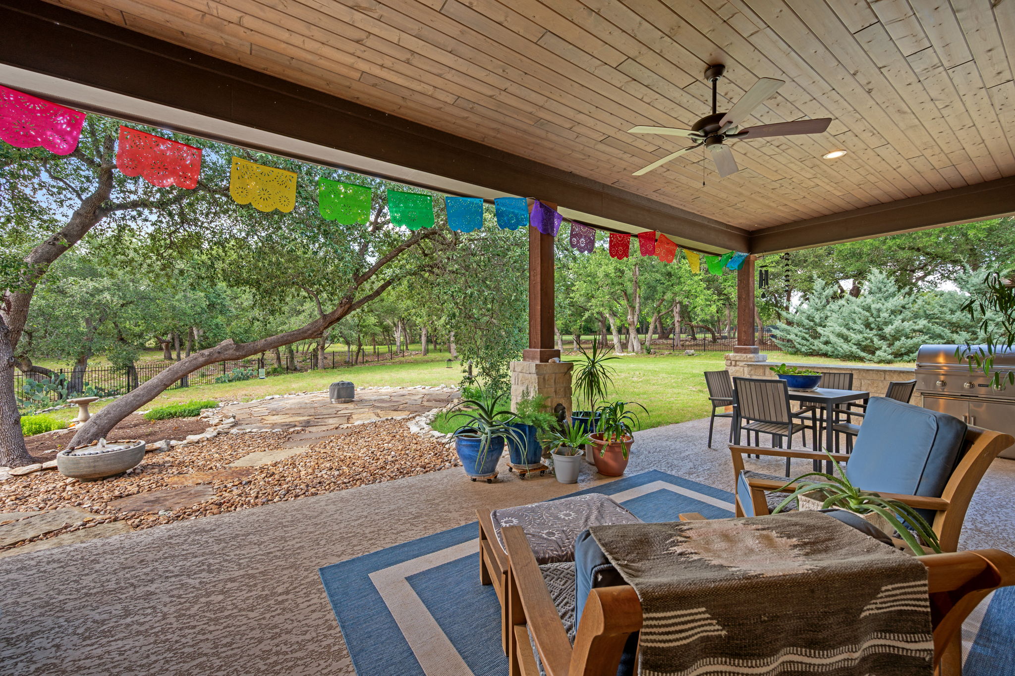 212 Marbella Way Georgetown, TX 78633 - Photo 30 of 40 a view of a patio with a table chairs and a backyard