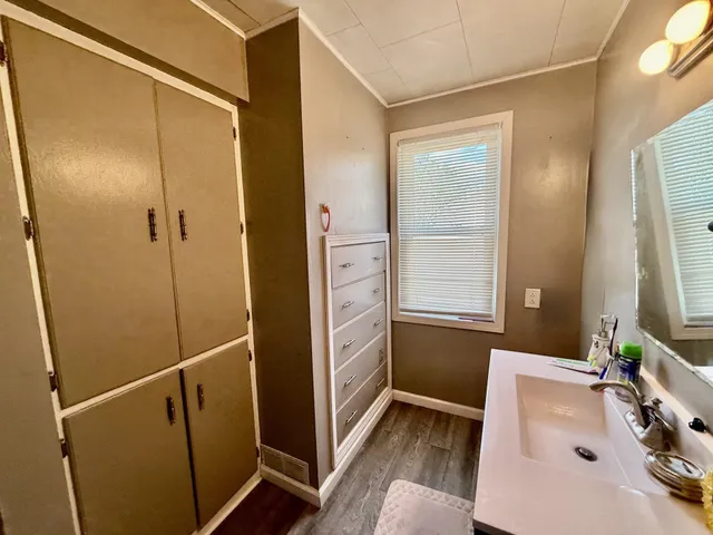 a bathroom with a bathtub and a sink