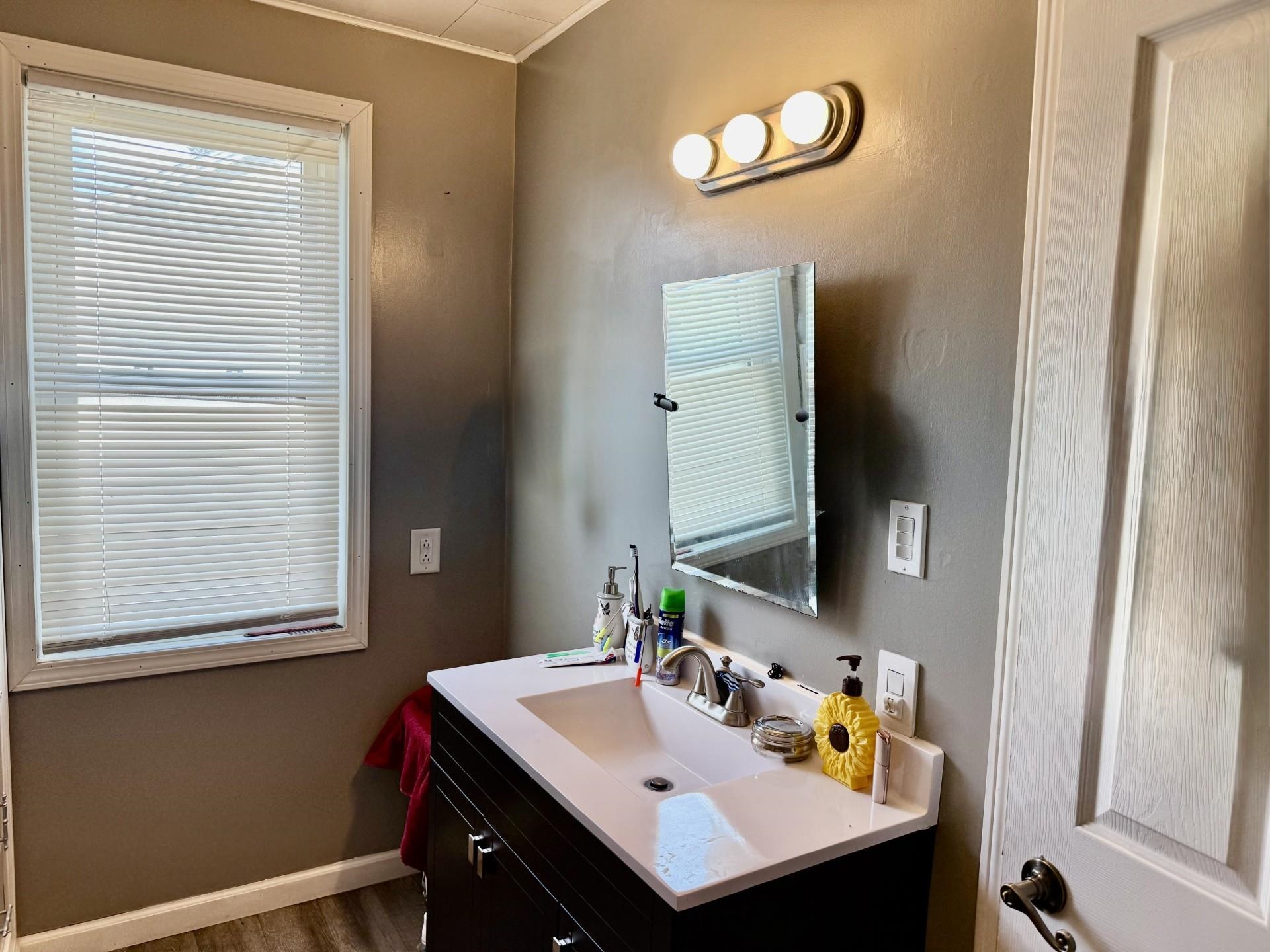 2731 7th Street Peru, IL 61354 - Photo 19 of 25 a bathroom with a sink vanity and a mirror