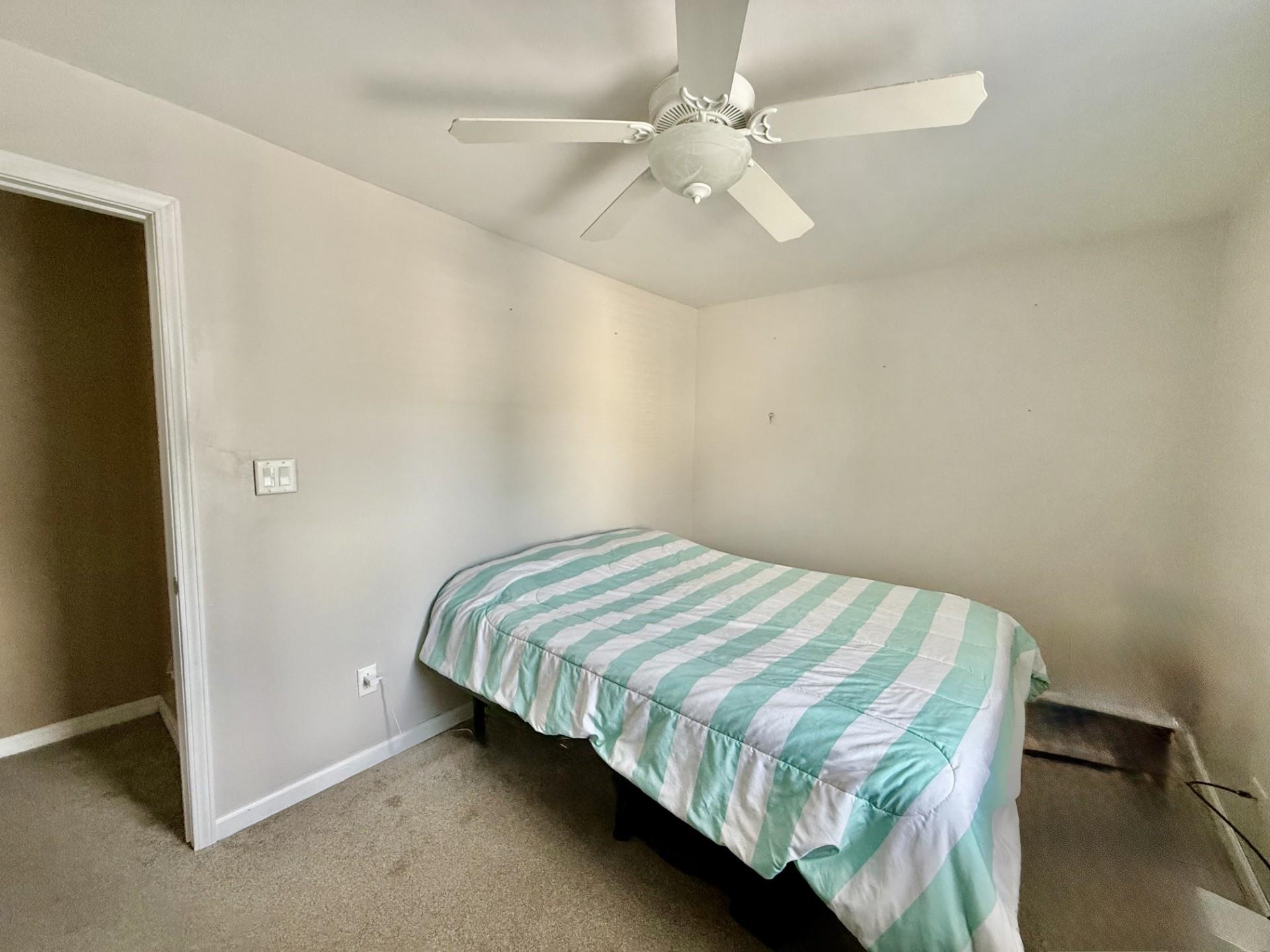 2731 7th Street Peru, IL 61354 - Photo 22 of 25 a bedroom with a bed and a ceiling fan