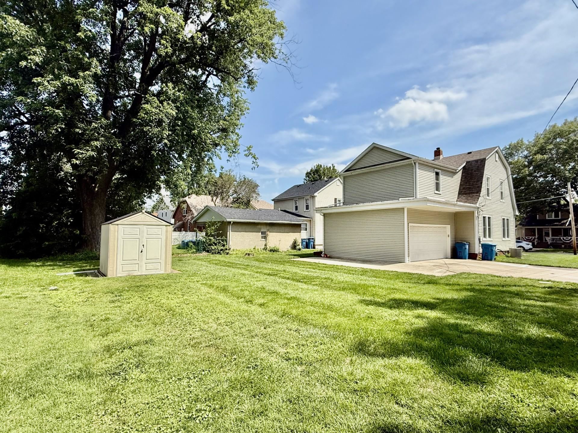 2731 7th Street Peru, IL 61354 - Photo 6 of 25 a front view of a house with a garden and yard