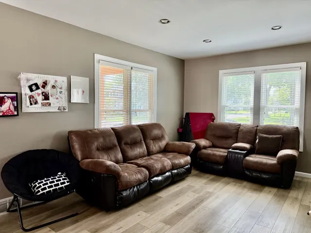 a living room with furniture and a window