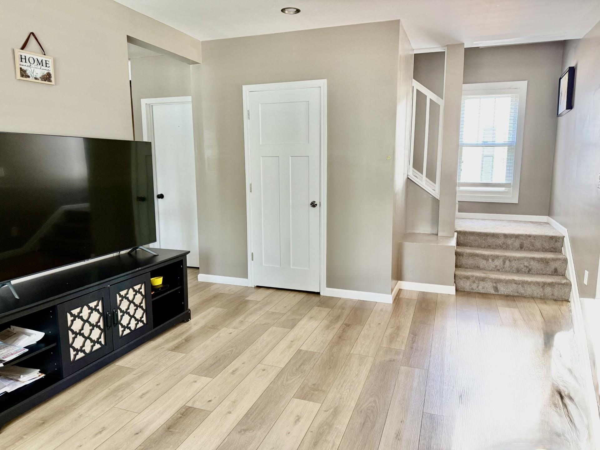2731 7th Street Peru, IL 61354 - Photo 10 of 25 a view of an empty room with a flat screen tv and a fireplace