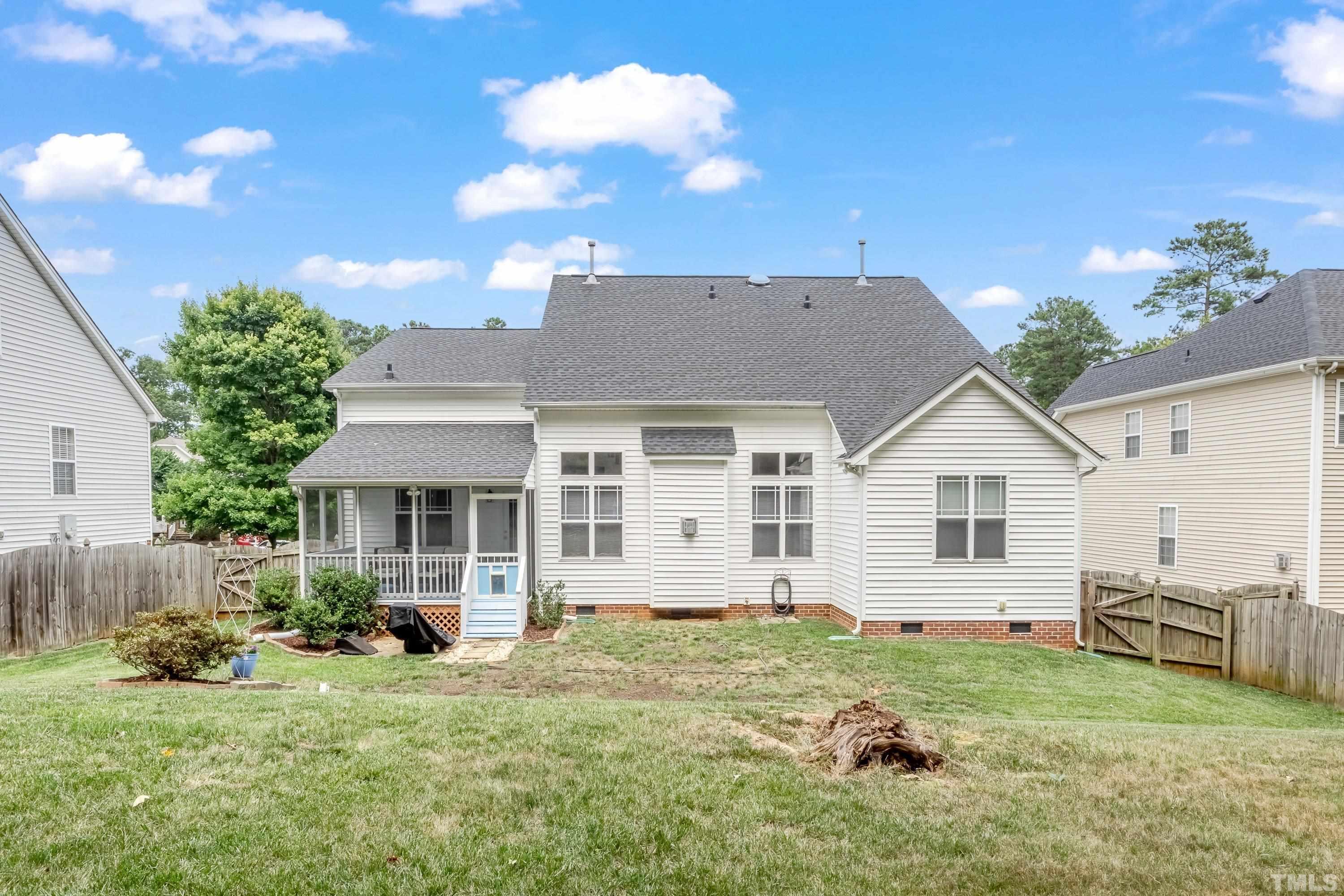 8613 Benzinger Drive Raleigh, NC 27613 - Photo 39 of 48 a view of a house with backyard and sitting area