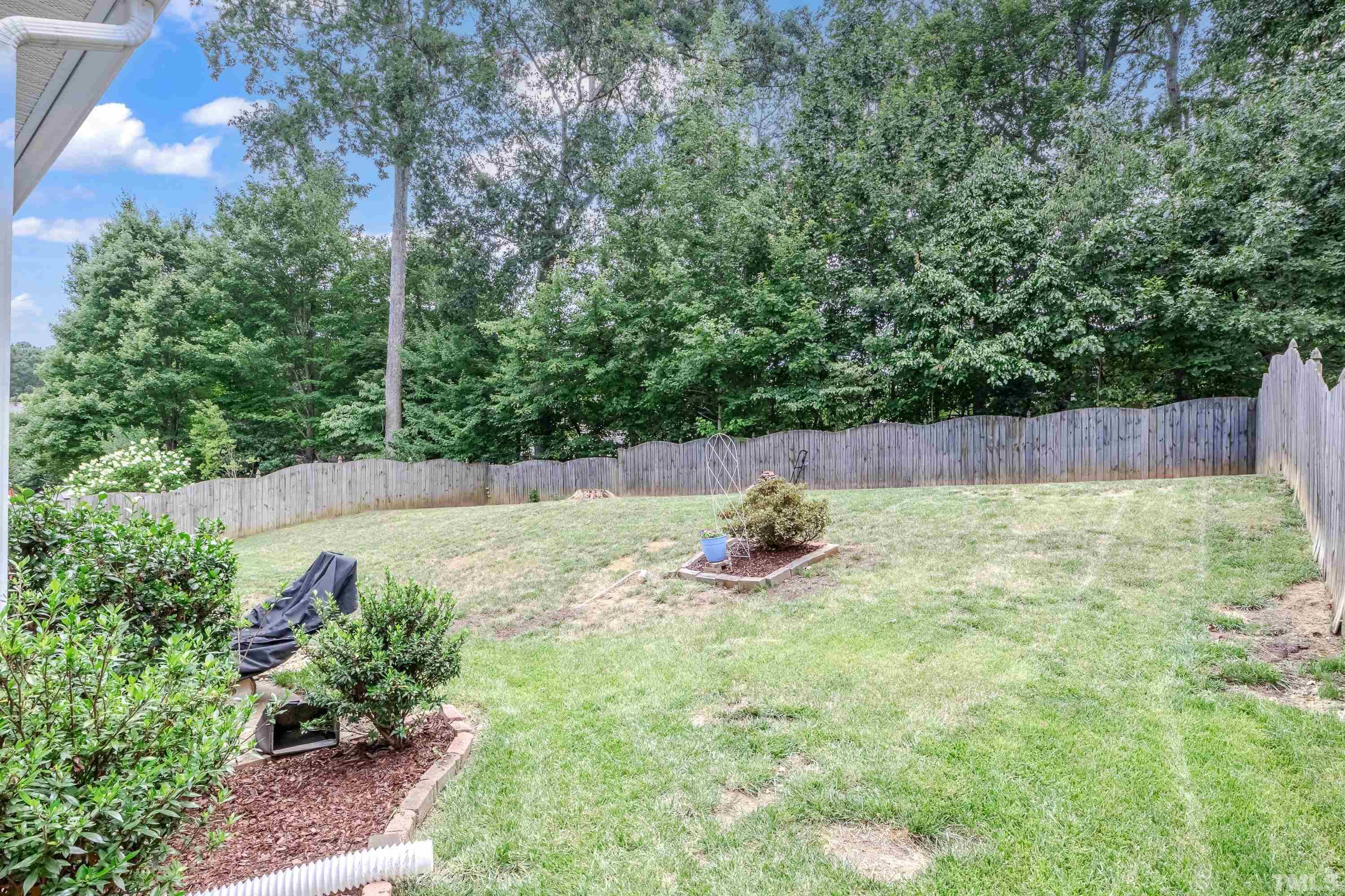 8613 Benzinger Drive Raleigh, NC 27613 - Photo 41 of 48 a view of a backyard