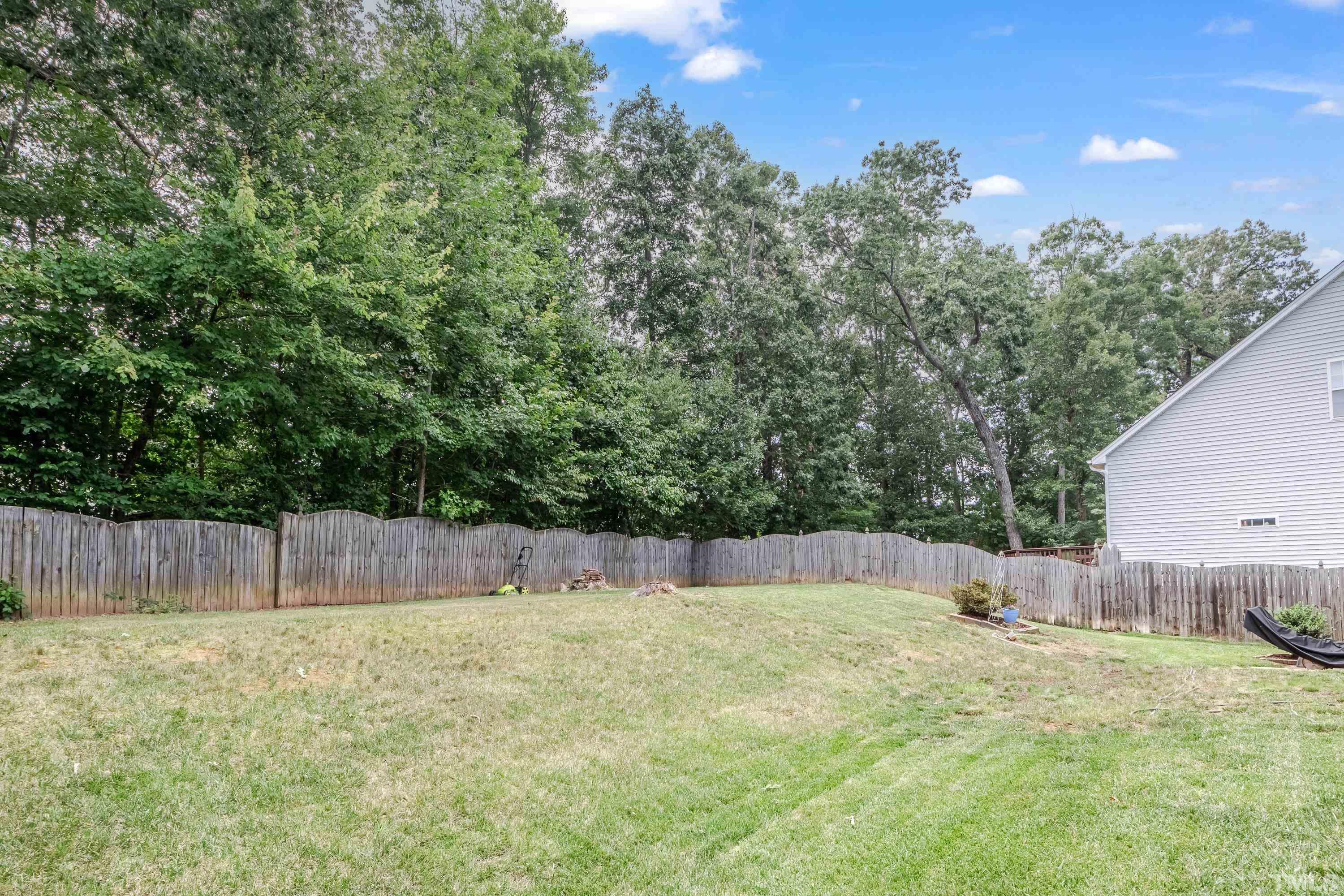 8613 Benzinger Drive Raleigh, NC 27613 - Photo 42 of 48 a backyard of a house