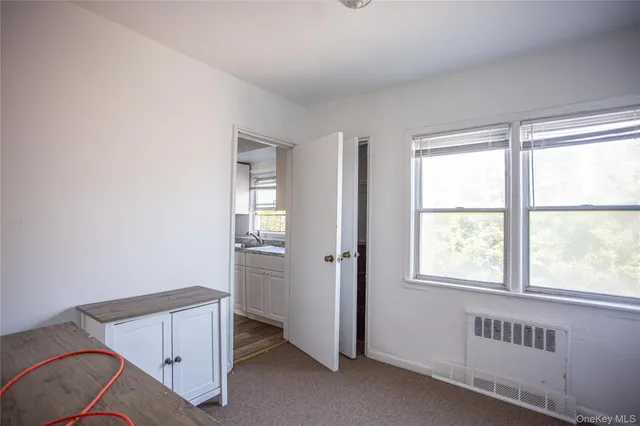 a view of an empty room and window