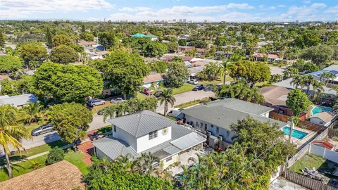 an aerial view of a house with a lake view