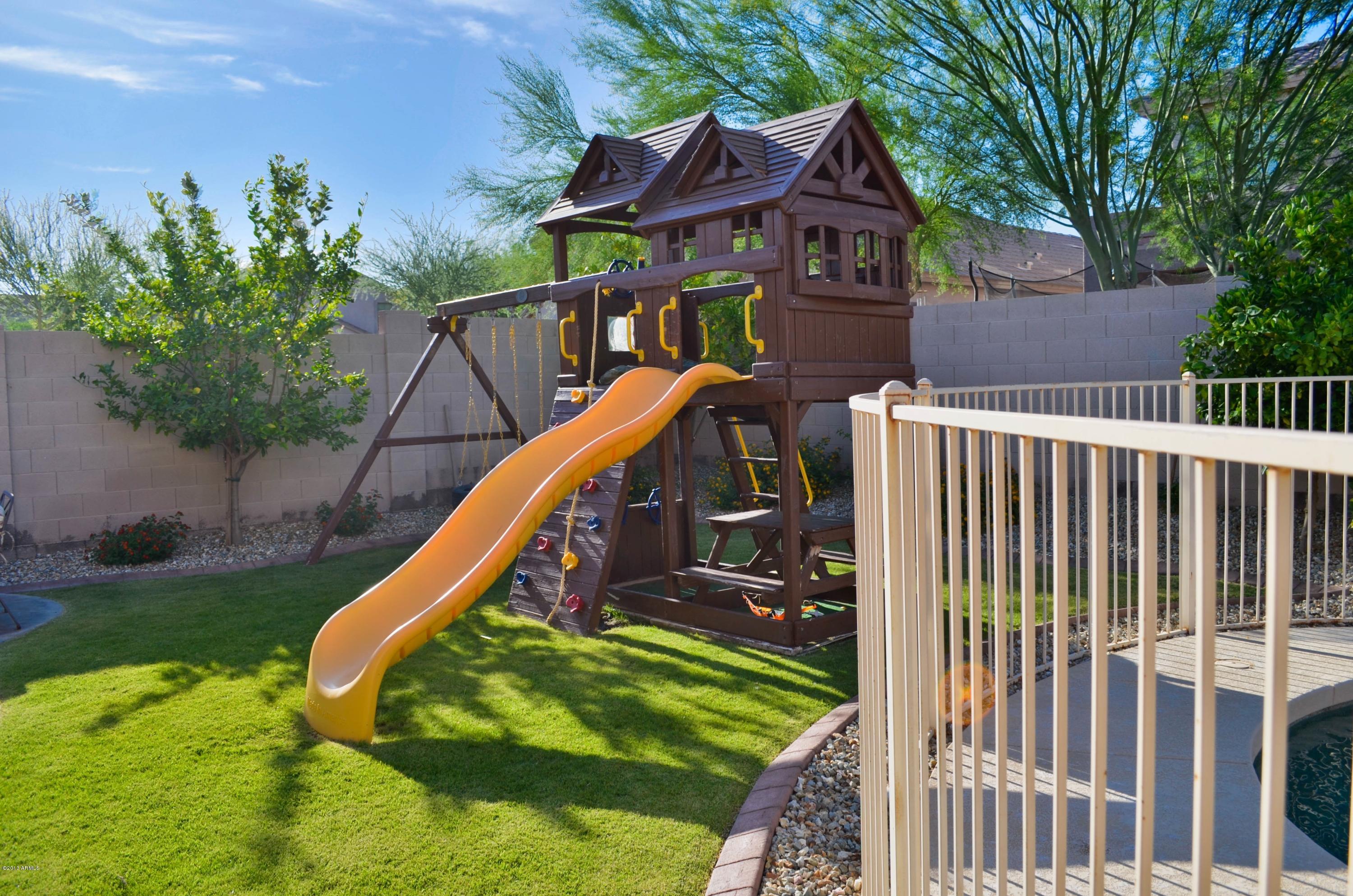 3218 West Sentinel Rock Road Phoenix, AZ 85086 - Photo 32 of 34 Lush Backyard With Play Climber