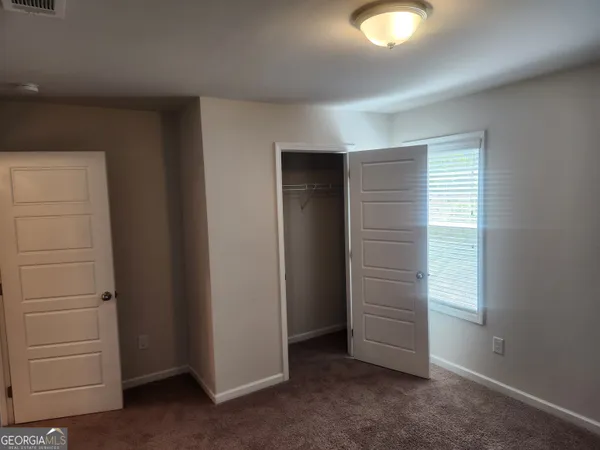 an empty room with closet