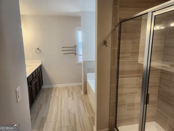 a view of bathroom with a sink and mirror