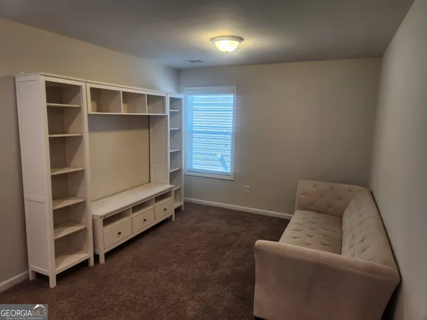 a room with furniture and closet