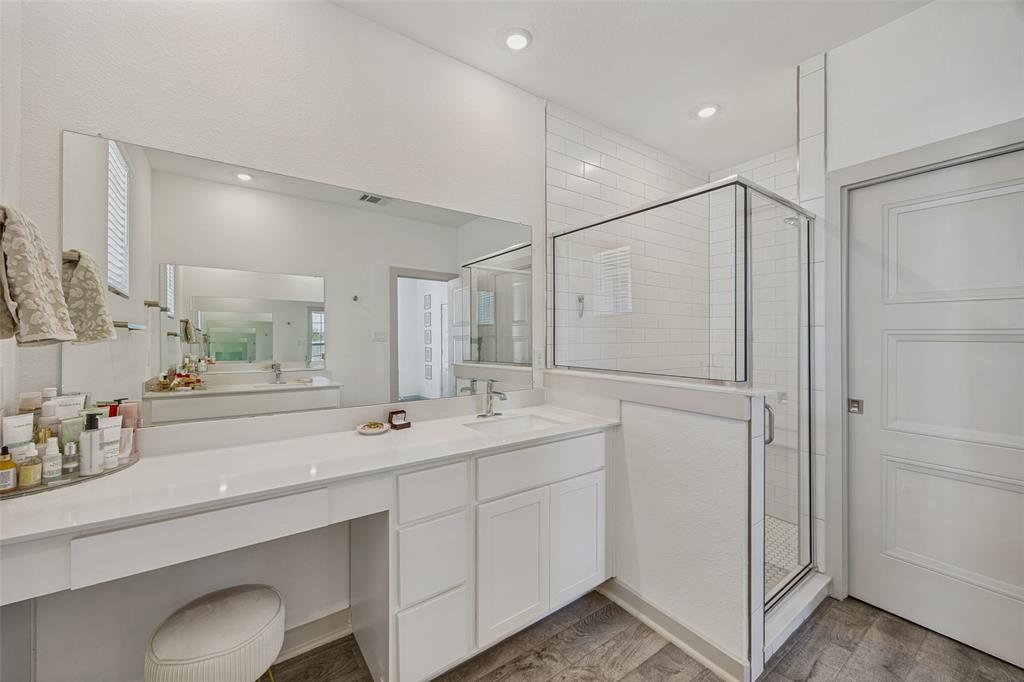 1650 Jessica Lane Allen, TX 75002 - Photo 22 of 25 a bathroom with a sink and a mirror