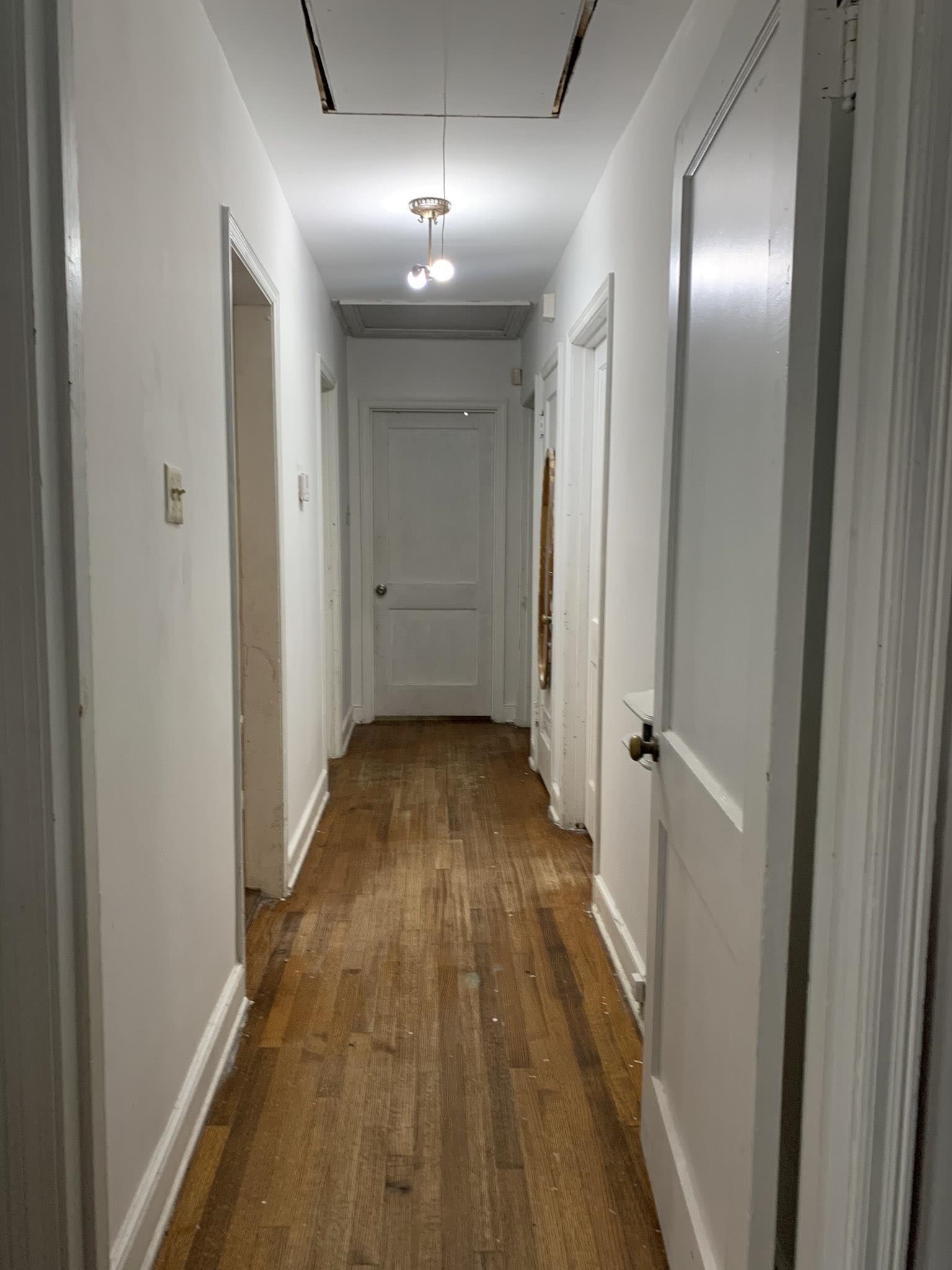 4395 Macon Road Memphis, TN 38122 - Photo 8 of 13 Hallway with hardwood / wood-style flooring