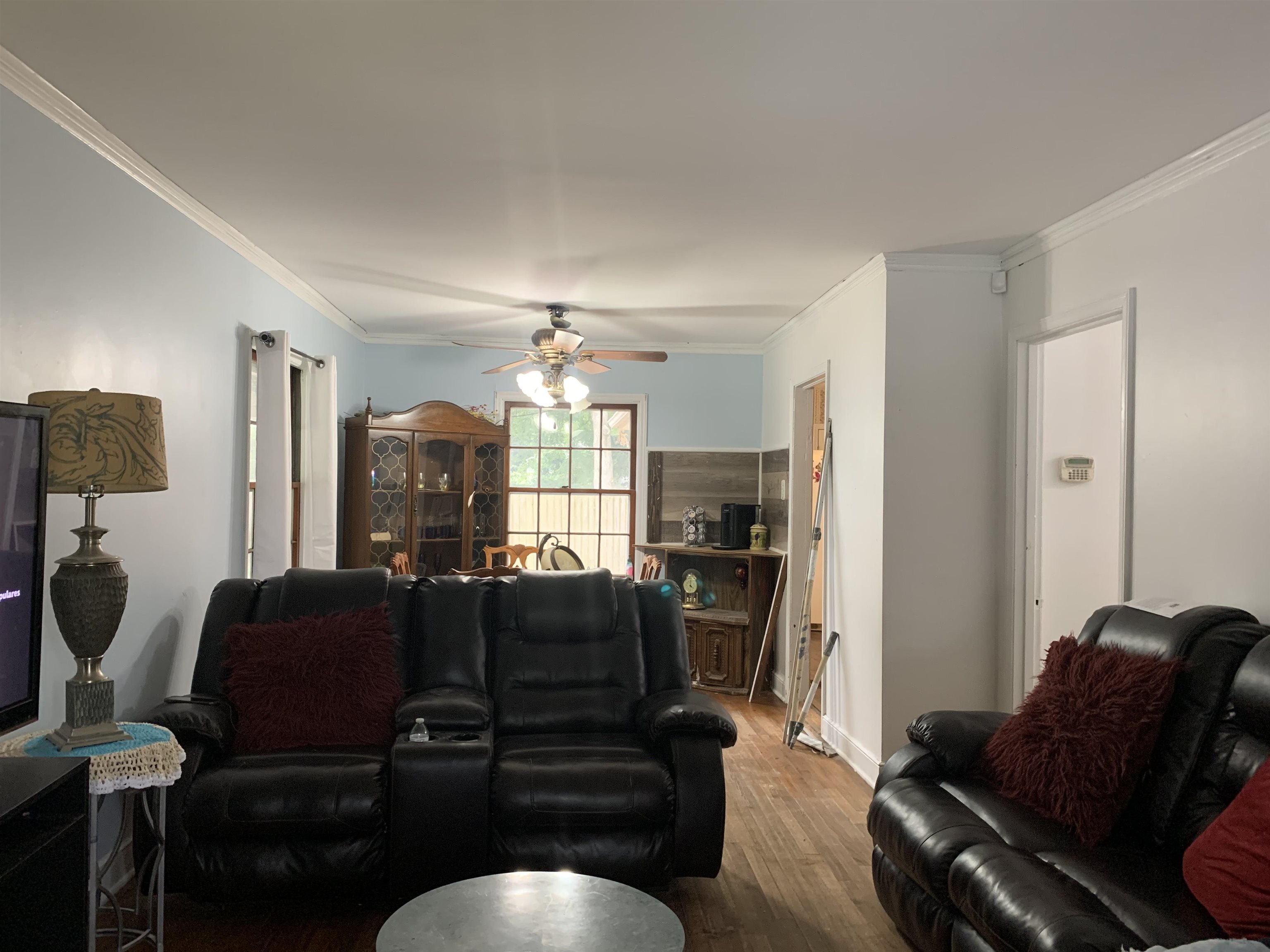 4395 Macon Road Memphis, TN 38122 - Photo 10 of 13 Living room with ceiling fan, hardwood / wood-style flooring, and ornamental molding
