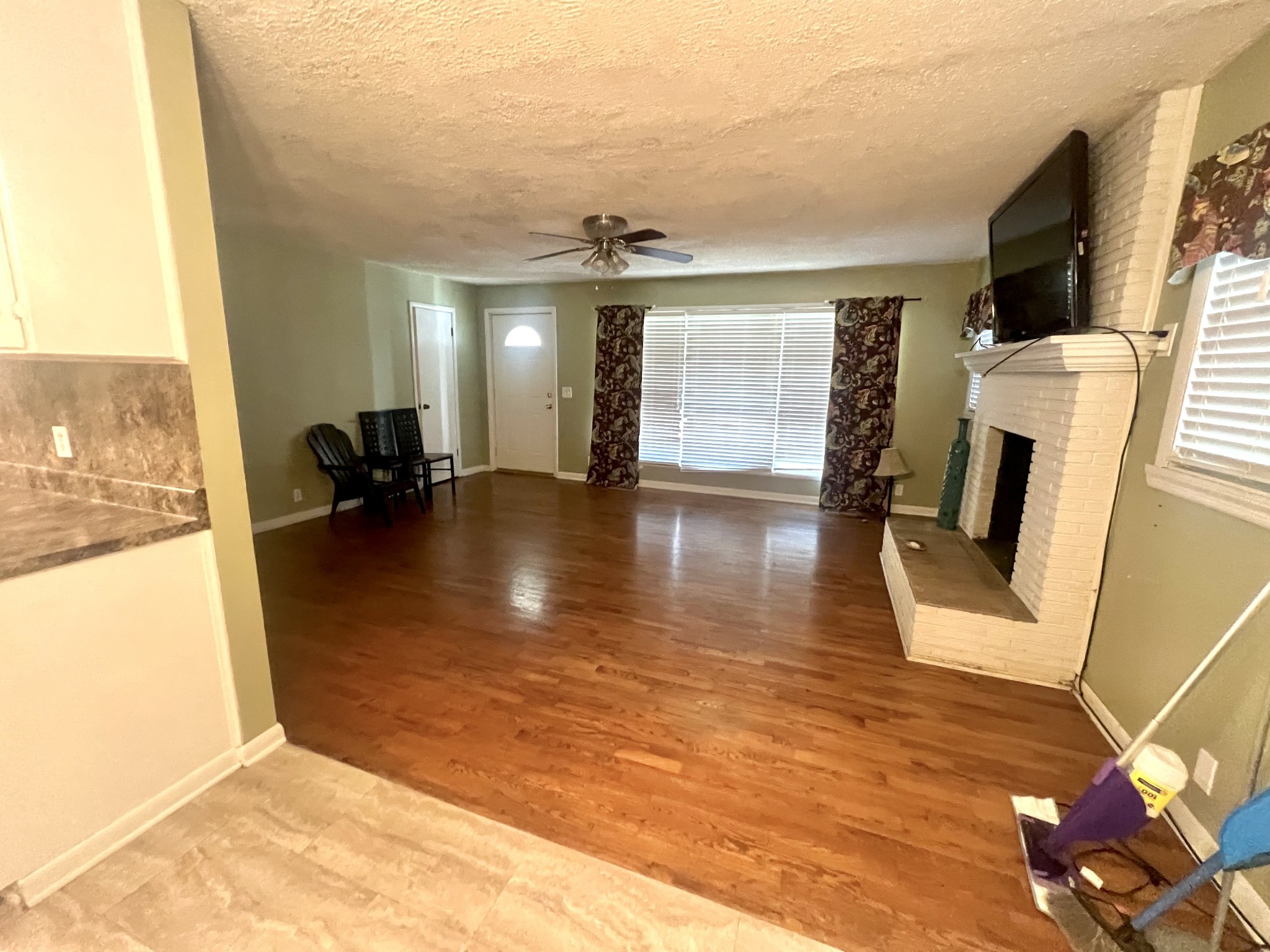403 West Point Road Lawrenceburg, TN 38464 - Photo 8 of 14 a view of living room with furniture and a fireplace