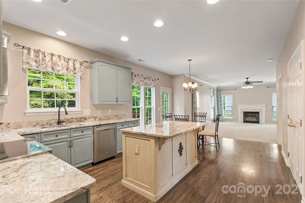 3028 Strawberry Road Matthews, NC 28104 - Photo 11 of 40 a large white kitchen with a large window