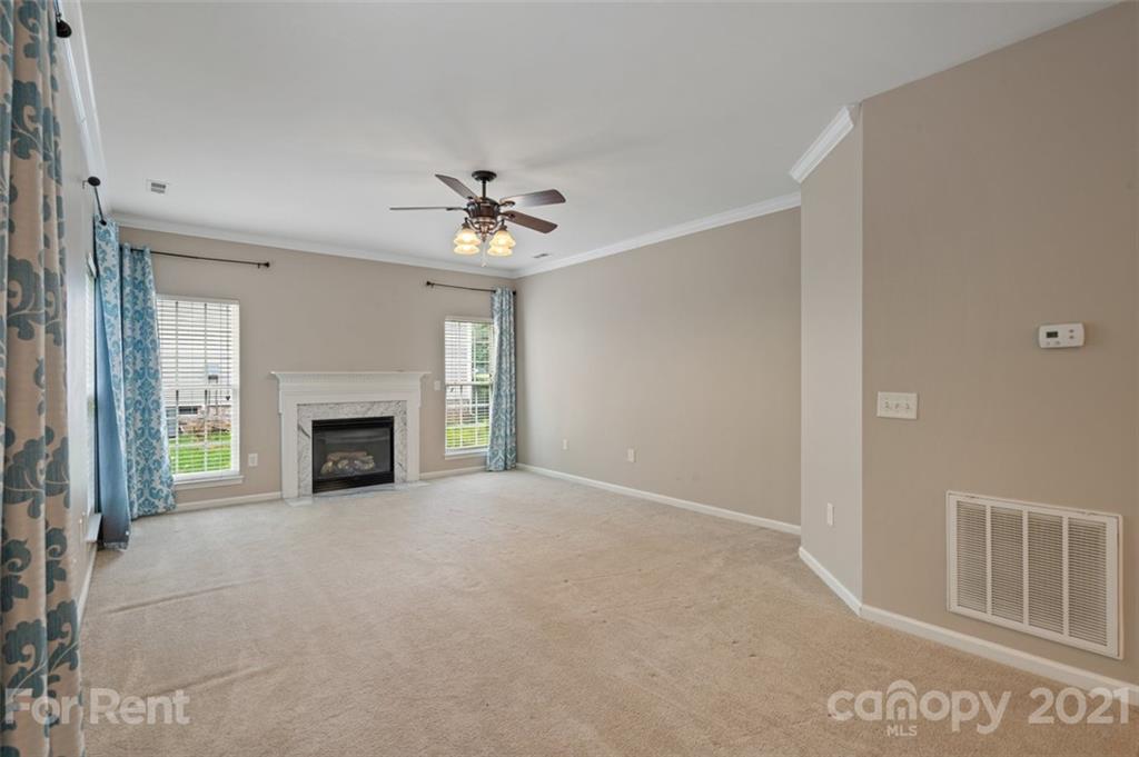 3028 Strawberry Road Matthews, NC 28104 - Photo 17 of 40 a view of an empty room with a fireplace