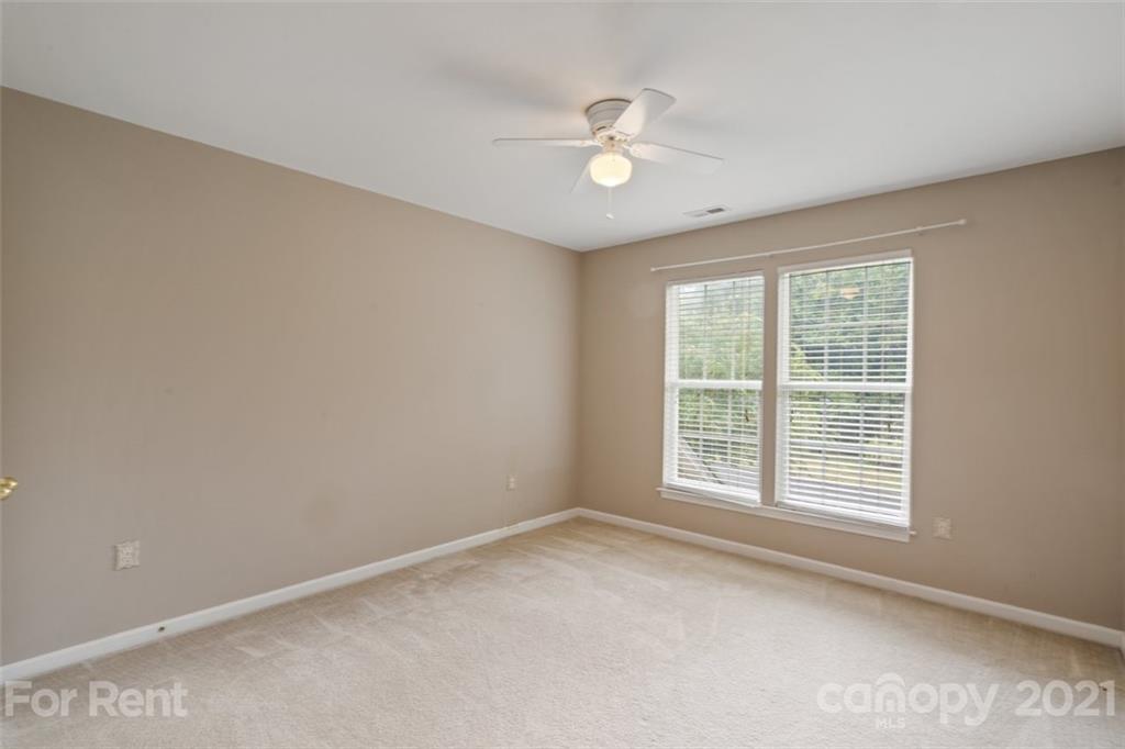3028 Strawberry Road Matthews, NC 28104 - Photo 19 of 40 a view of an empty room with a window